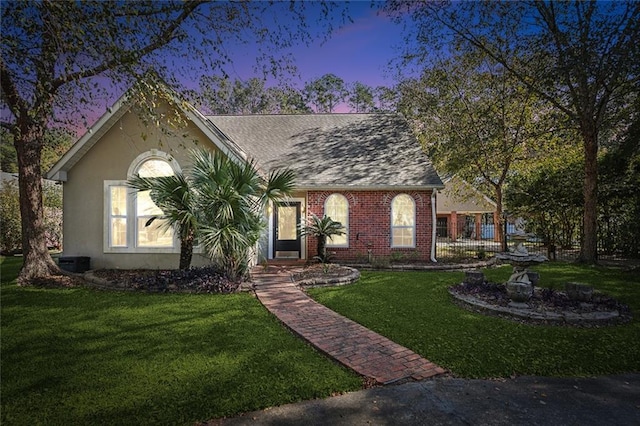 246 Cypress St, Independence, LA 70443 - ranch-style home with brick siding, central AC, and a front yard