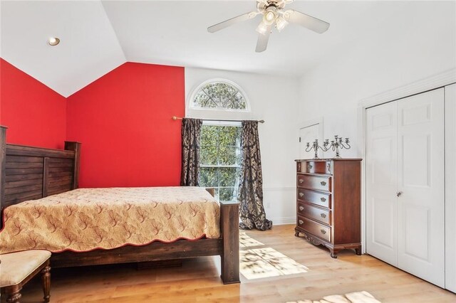 bedroom with vaulted ceiling, ceiling fan, and light hardwood / wood-style floors