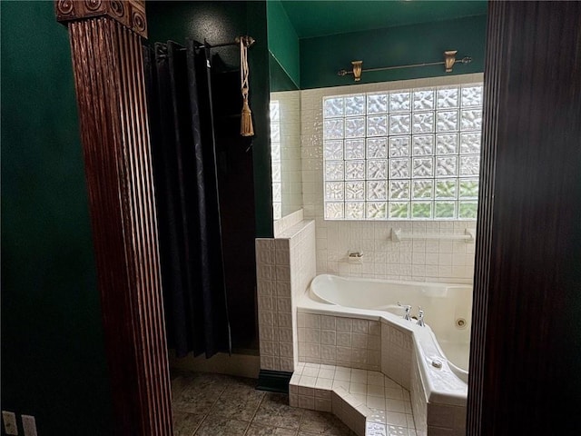246 Cypress St, Independence, LA 70443 - full bathroom with a whirlpool tub, a shower with shower curtain, and tile patterned flooring