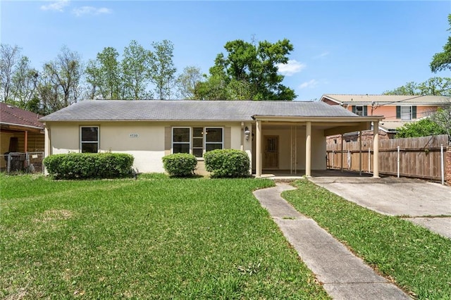 ranch-style home with a front lawn and a carport