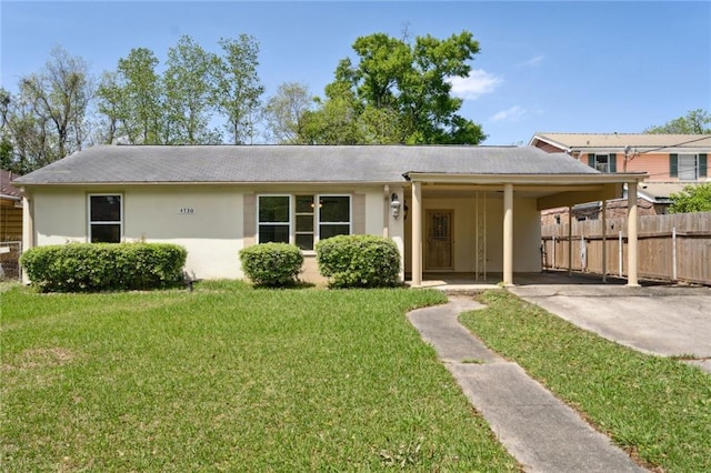 ranch-style house with a carport and a front yard