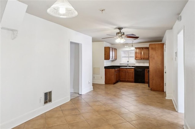 kitchen featuring sink, dishwasher, ceiling fan, pendant lighting, and light tile patterned floors