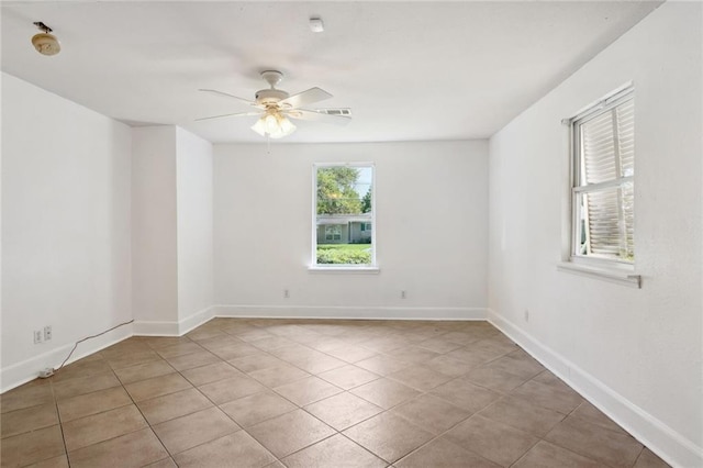 unfurnished room with light tile patterned floors and ceiling fan