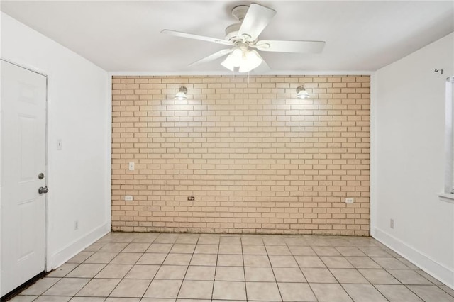 unfurnished room with light tile patterned floors and ceiling fan