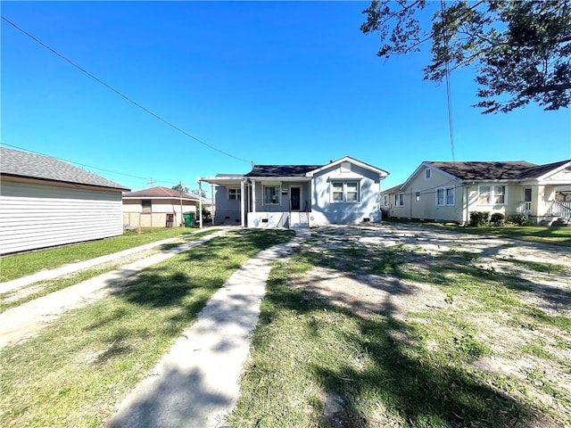 view of front of property with covered porch and a front yard