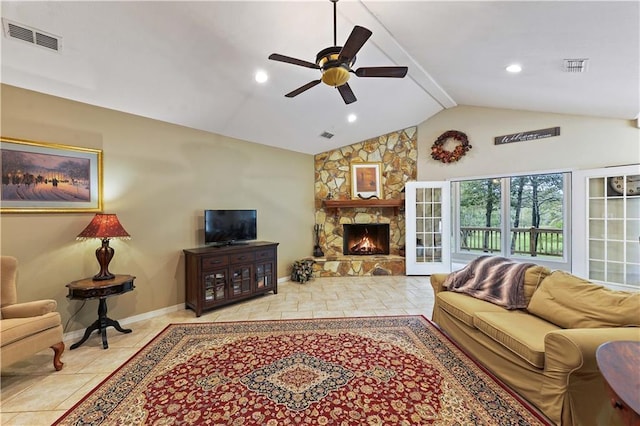 living room featuring ceiling fan, a fireplace, and vaulted ceiling