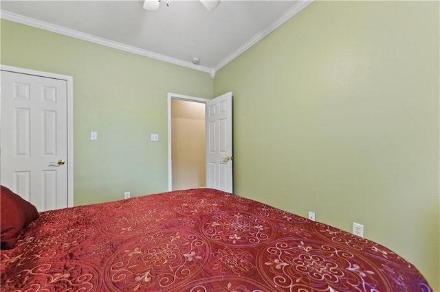 bedroom featuring ceiling fan and ornamental molding