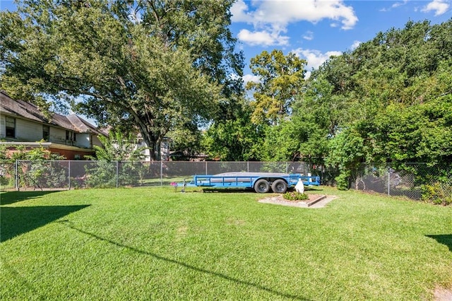 view of yard featuring a fenced in pool