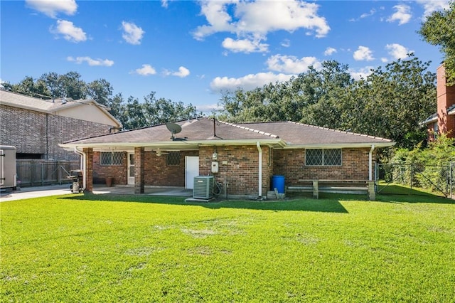 back of house featuring a yard, cooling unit, and a patio area