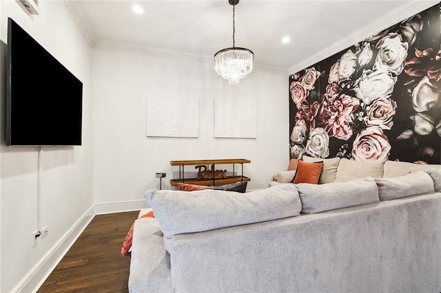 living room featuring dark wood-type flooring, crown molding, and an inviting chandelier