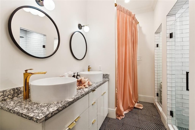 1900 N Rampart St, New Orleans, LA 70116 - bathroom featuring a shower stall, double vanity, ornamental molding, and tile patterned flooring