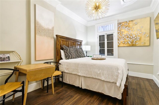 1900 N Rampart St, New Orleans, LA 70116 - bedroom featuring crown molding, dark wood-style floors, and a chandelier