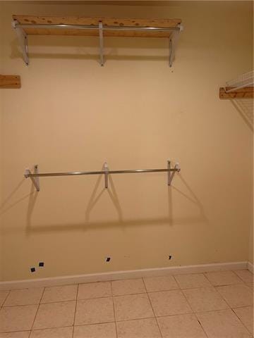 walk in closet featuring light tile patterned floors