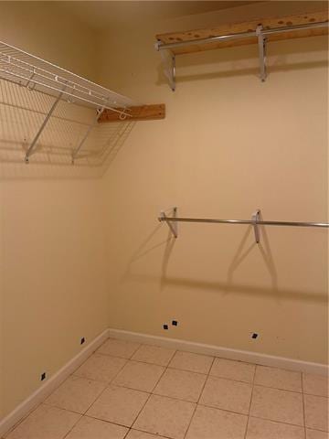 walk in closet featuring light tile patterned floors