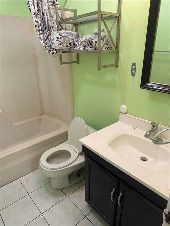 full bathroom with toilet, bathtub / shower combination, vanity, and tile patterned floors