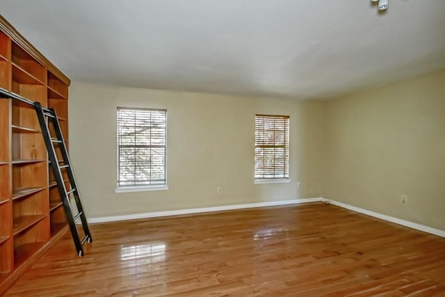 spare room featuring hardwood / wood-style floors