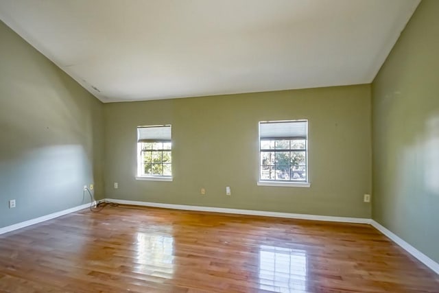 spare room with light hardwood / wood-style flooring