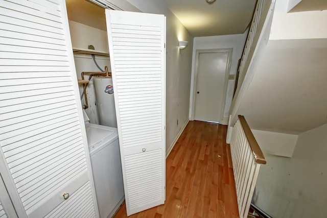 laundry area featuring washer / dryer, gas water heater, and hardwood / wood-style floors