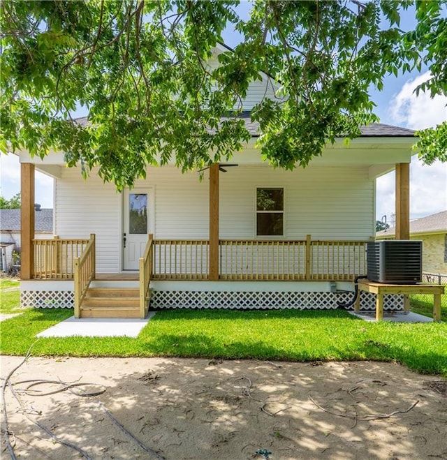 5144 Richland Ave, Marrero, LA 70072 - view of front of home with covered porch, cooling unit, and a front lawn