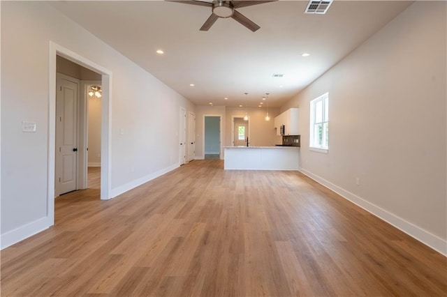 5144 Richland Ave, Marrero, LA 70072 - unfurnished living room featuring ceiling fan, baseboards, light wood-style floors, and recessed lighting