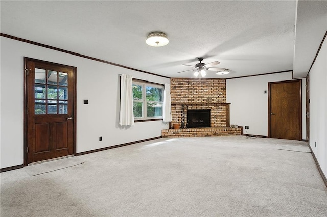 unfurnished living room with a fireplace, crown molding, light colored carpet, a textured ceiling, and ceiling fan