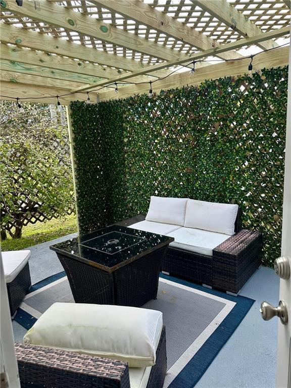 view of patio / terrace featuring outdoor lounge area and a pergola