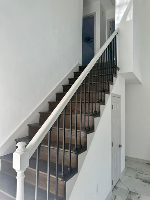 stairway with a towering ceiling