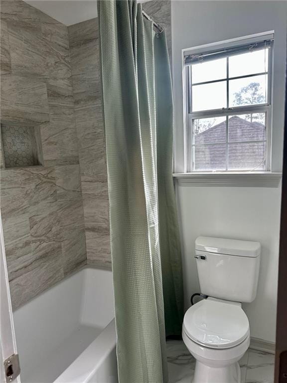 bathroom with toilet and shower / tub combo with curtain