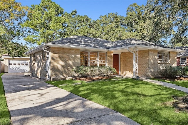 single story home featuring a front yard and a garage