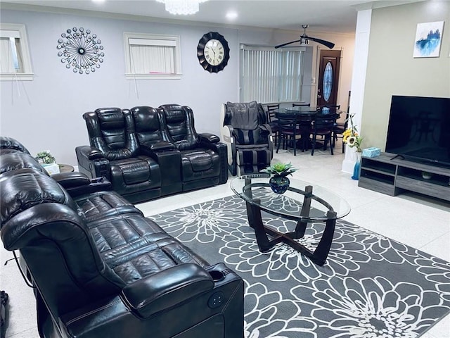 cinema room featuring crown molding and ceiling fan