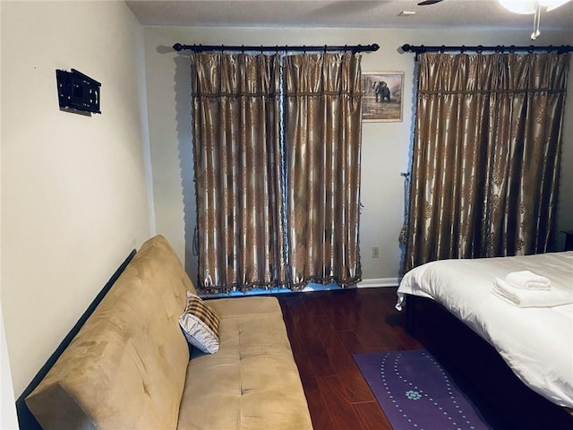 bedroom featuring hardwood / wood-style flooring and ceiling fan