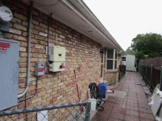 view of side of home featuring a patio area