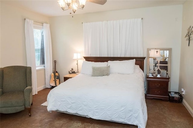 bedroom featuring ceiling fan and dark carpet