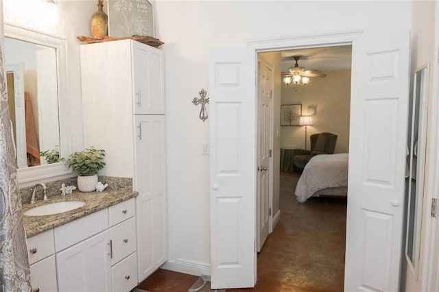 bathroom featuring ceiling fan and vanity