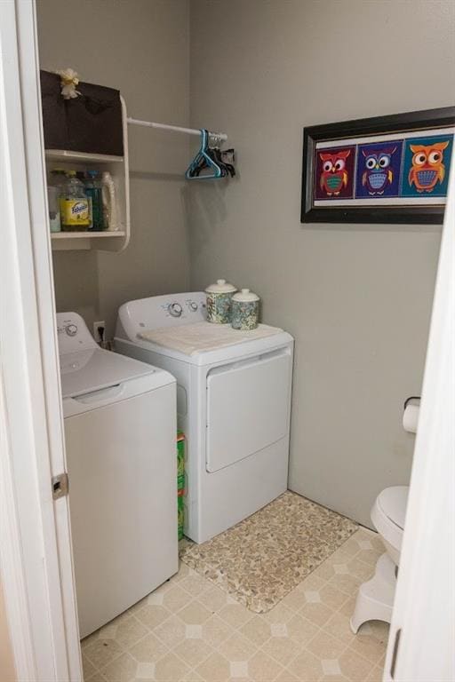 clothes washing area featuring washing machine and clothes dryer