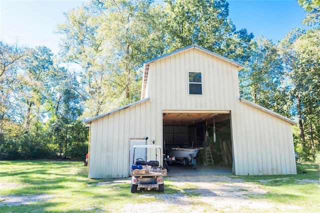 view of outbuilding featuring a lawn