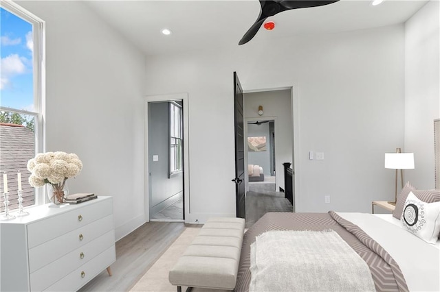 bedroom featuring recessed lighting, baseboards, ceiling fan, and light wood finished floors