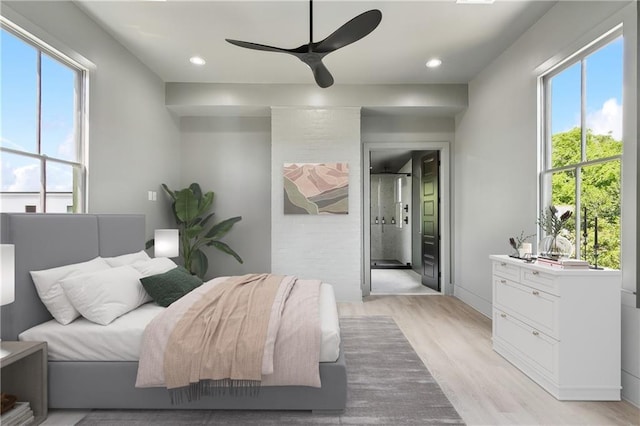 bedroom with ceiling fan, light wood-type flooring, connected bathroom, and recessed lighting