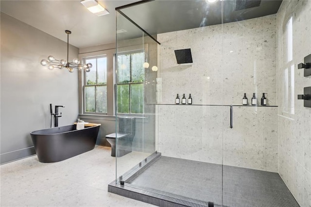 bathroom featuring a soaking tub and a shower stall