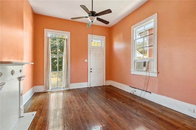 entryway featuring cooling unit, dark wood-type flooring, plenty of natural light, and ceiling fan