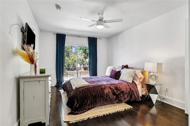 bedroom with ceiling fan and dark hardwood / wood-style floors