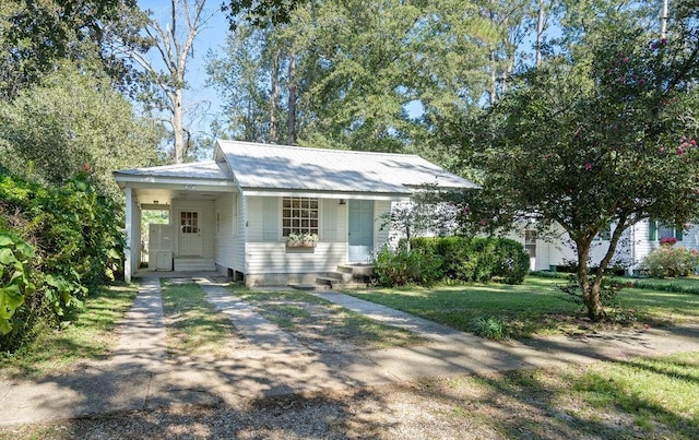 view of front of home with covered porch and a front yard