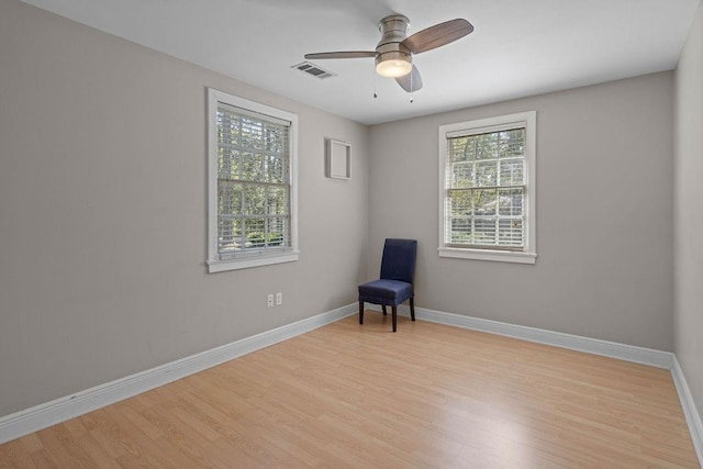 unfurnished room featuring ceiling fan, light hardwood / wood-style flooring, and plenty of natural light