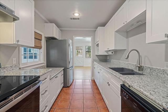 kitchen featuring exhaust hood, sink, crown molding, white cabinetry, and appliances with stainless steel finishes