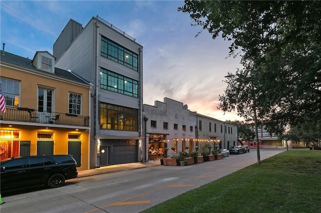 outdoor building at dusk with a garage