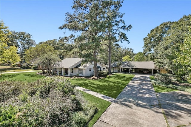 ranch-style home featuring a front lawn and a carport