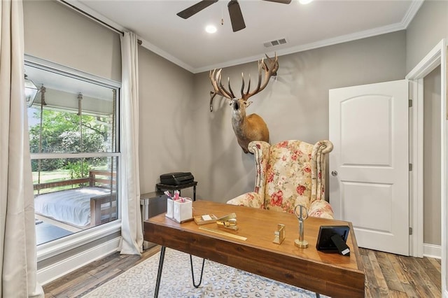 office space featuring ceiling fan, wood-type flooring, and ornamental molding