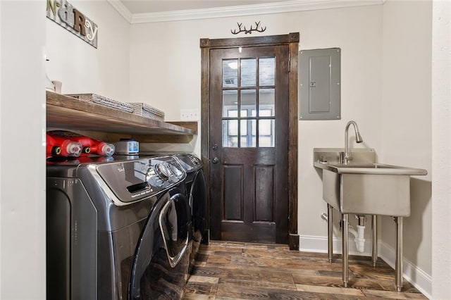 washroom featuring sink, dark hardwood / wood-style flooring, washer and clothes dryer, ornamental molding, and electric panel