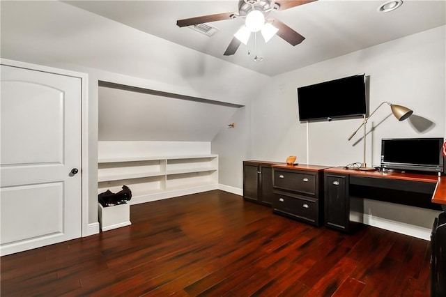 office with built in desk, vaulted ceiling, ceiling fan, and dark hardwood / wood-style flooring