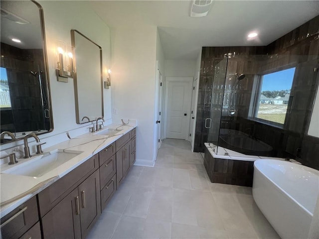 bathroom featuring vanity, shower with separate bathtub, and tile patterned flooring